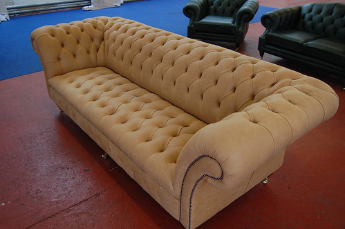 quilted leather couch. tan chesterfield sofa.