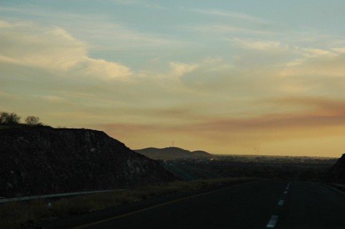 Smoke from burning tires to cause rain, entering Jalisco from Sonora, along highway 15, Mexico by Wonderlane