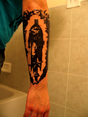 New Mignola batman tattoo behind my hellboy one
