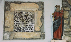 Inscription et la vierge au flambeau