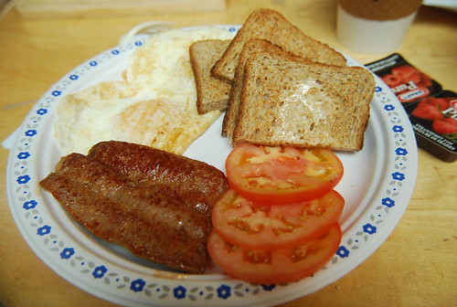 Eggs, sausage, toast and tomatoes