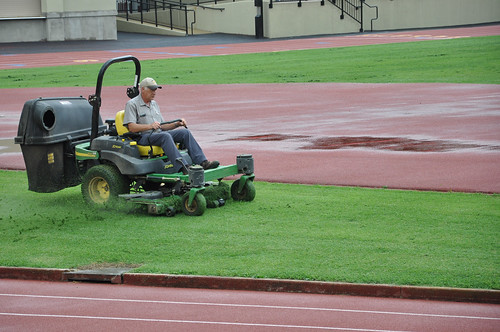 Cutting the grass at the Virginia Military Institute on Main Street in Lexington, Virginia.