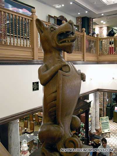 Wooden dog that guards the stairway