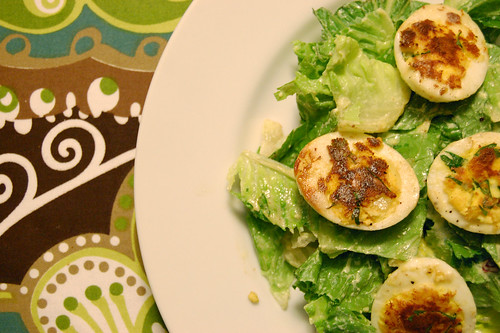 Pan-Seared Deviled Eggs on French Greens