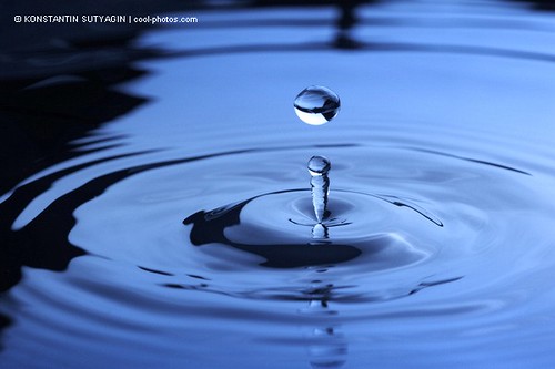 water droplet. Water drop falling into water