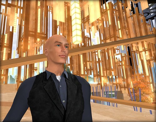 DB Bailey used Second Life to win a new Real Life client: Standing here in front of the building he created for Stanford University in Second Life by Bettina Tizzy