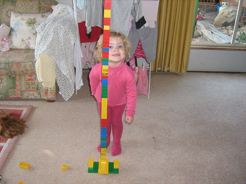 Maisie Whitbourn with her tower of Duplo