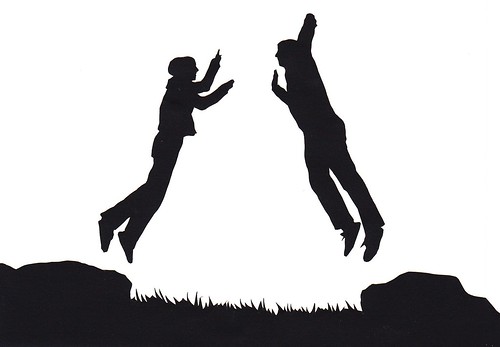 couple kissing silhouette image. couple jump silhouette