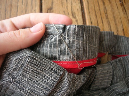 A few extra minutes handsewing results in a sturdy, lovely-looking belt carrier detail.
