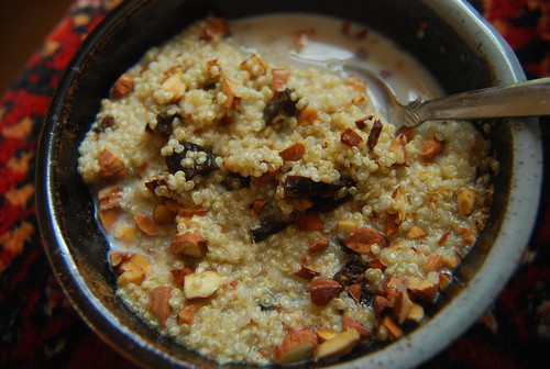 Quinoa porridge with roasted almonds, prunes and almond milk
