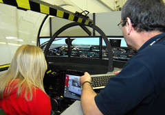 Laura on flight simulator by WISE Campaign