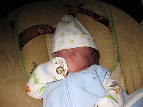 Ethan crashed out on bouncy chair with his hat over his eyes - 2