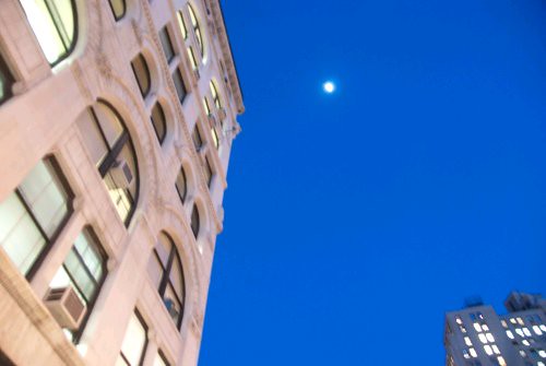 The moon against the blue sky in New York City