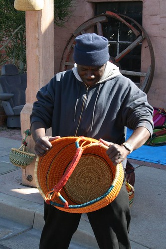 Abdullah shows his baskets for sale