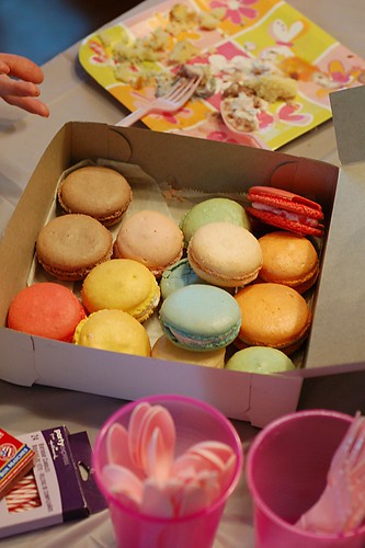 Assorted macarons in a bakery box.