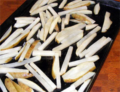 oven fries in a shallow baking pan
