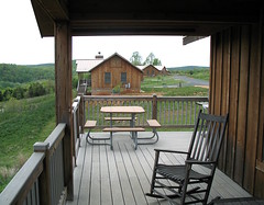 Cabin side view, with neighboring cabins and picnic table
