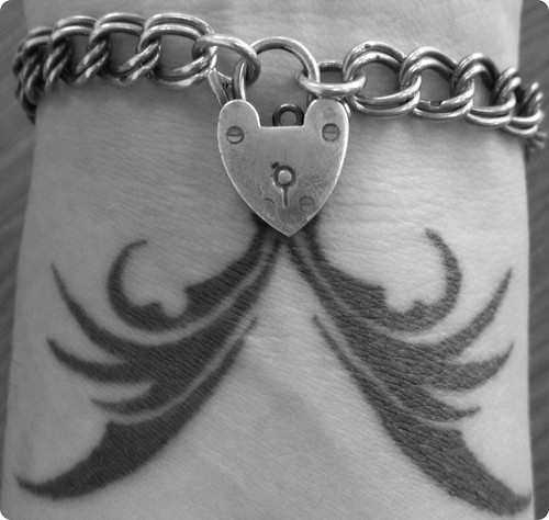 My left wrist with my tattoo done in December 2007 and a silver bracelet