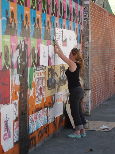 Julia wheatpasting on Deappropriation Wall