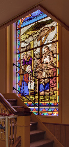 Immaculate Conception (Saint Mary's) Roman Catholic Church, in Brussels, Calhoun County, Illinois, USA - stained glass window of the Nativity; stairs leading to the choir loft