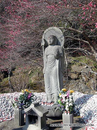A smaller Buddha statue nearby