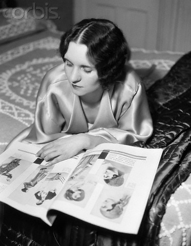 1925 --- 1920s 1930s Reclining Woman With Marcel Wave Hair Style Reading A 