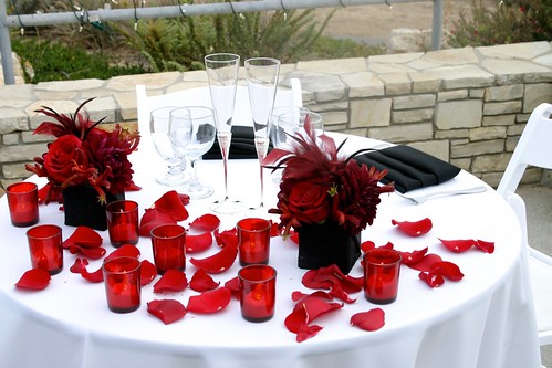 Red white and black sweetheart table setup Centerpieces sexy red roses 