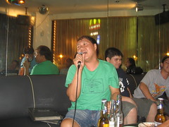Tito Bong sings a song at Karaoke