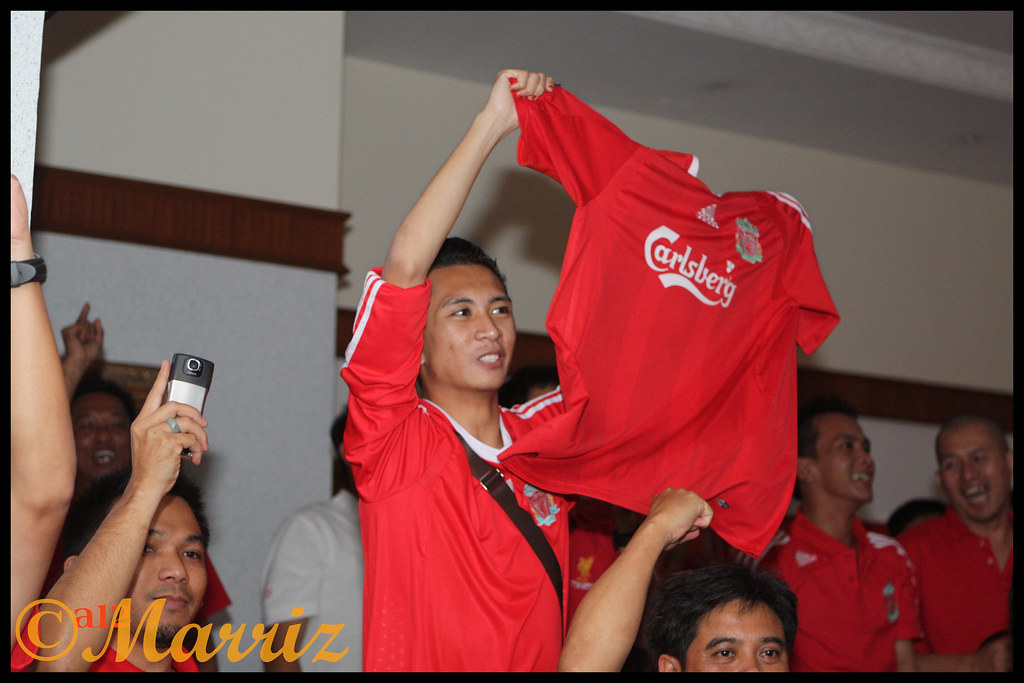 Waving the Liverpool jersey