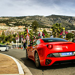 Ferrari California and Lamborghini parked in front of Hotel the Paris