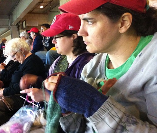 Knitters watch the pitch while they stitch