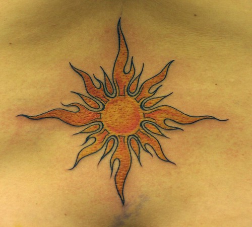  sun tattoo, lower back 