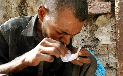 ABBOTTABAD: 25Jun2008 A Pakistani drug addict smokes heroin in Abbottabad on the eve of International anti Narcotics Day. PHOTO by Sultan Dogar