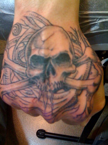 hand tattoo designs. Hand tattoos by Tas Red skull