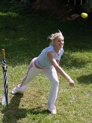 Hanna bowling at the backyard cricket