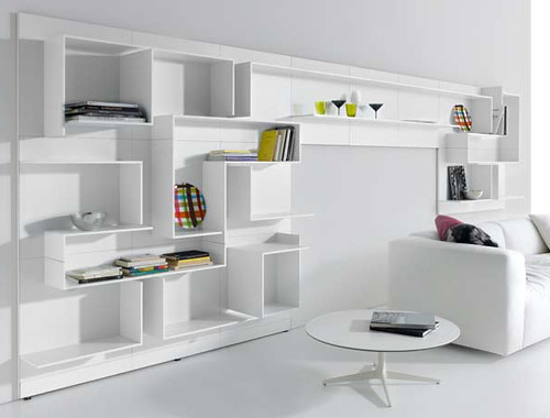 The modern white wall unit with gorgeous sitting room sofa