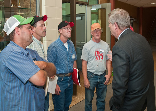 From left: Farmers Steve Roth, Done Rief, Dale Rief, Clifford Dilts discuss topics covered during a town hall meeting with Agriculture Secretary Tom Vilsack at the Glenwood Community High School in Glenwood, Iowa on Thursday, June 16, 2011. Farmers, local and regional media listened and questioned Secretary Vilsack on the cause of the floodwaters along the Missouri River affecting Iowa and Nebraska. Secretary Vilsack offered advice and assistance available through the United States Department of Agriculture and other federal agencies.