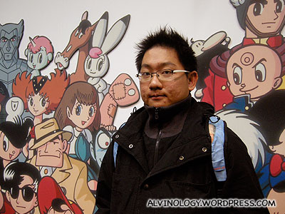 Me with Tezuka Osamu created anime and manga characters as backdrop