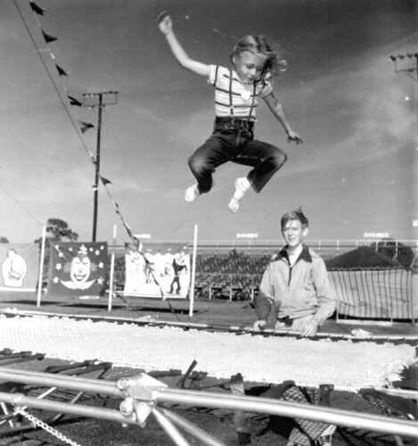 Young girl jumping on a trampoline at the Sarasota High School Sailor Circus
