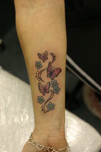 butterflys and flowers tattoo on wrist