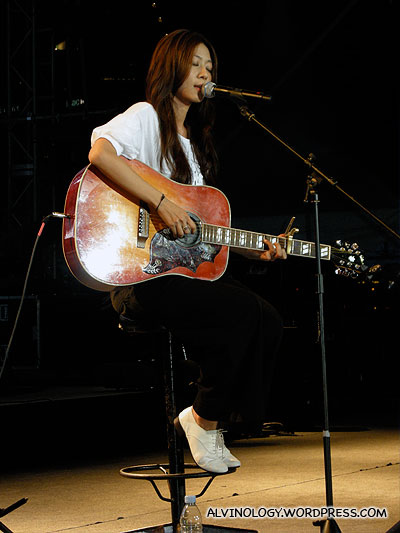 Cheer Chen on the guitar and singing
