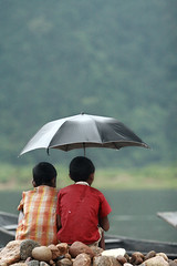Two boy with umbrella