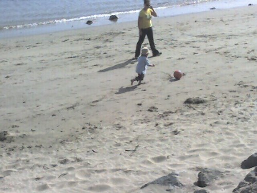 Mason playing soccer at the beach