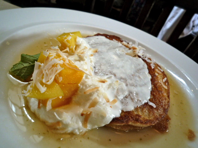 Coconut pancakes with fresh ricotta, mango salad and ginger-lime syrup