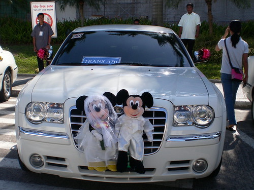 A bridal car with Mickey and Minnie Mouse in it adds a unique touch from the