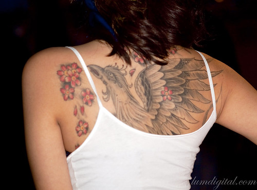 Brianna Tran cool back tattoo. Upper portion of Brianna's phoenix tat