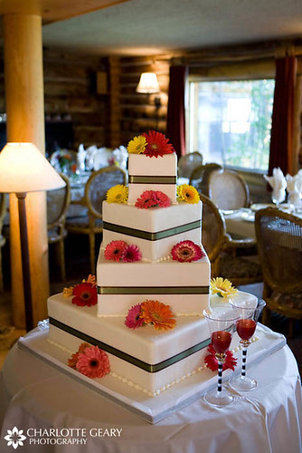 Square wedding cake with gerbera daisies