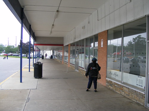 Woman In The Empty Shopping Center