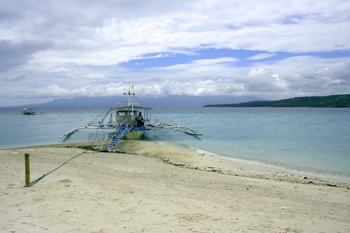boat docked at shifting sand bar