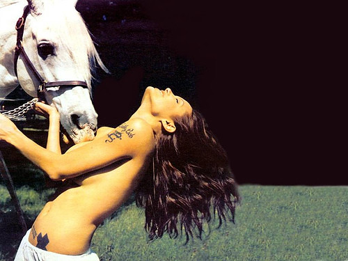 Angelina Jolie topless with horse